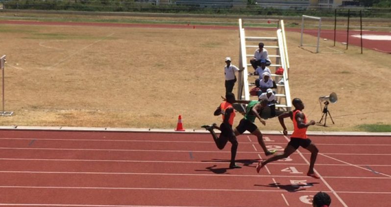 GDF's Rupert Perry cruises to win one of the men's 200m heats.