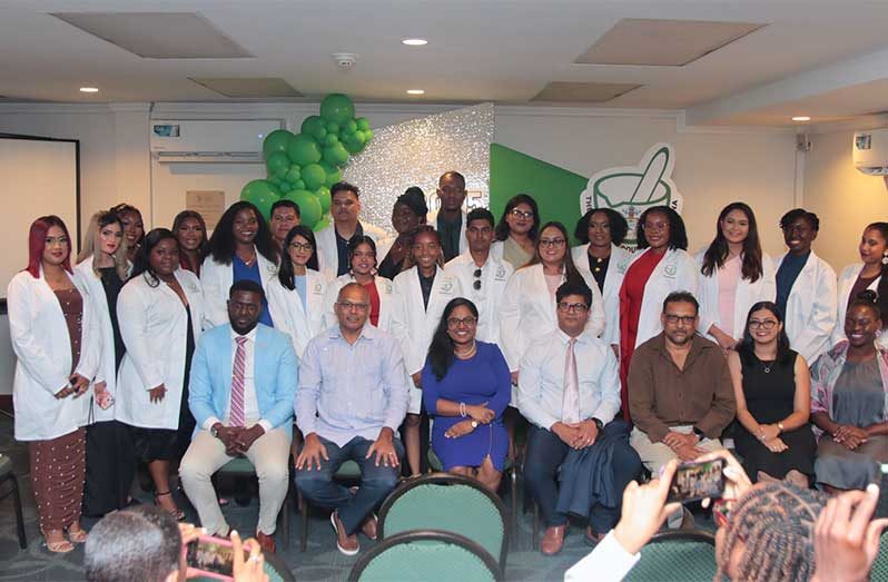 pharmacist The newly-licenced pharmacists are joined by (seated from left) President of the Guyana Pharmacists Association, Mr. Kwame Waldron; Dr Frank Anthony, Minister of Health; Chair of the Pharmacy Council of Guyana, Dr. Karishma Jeeboo; Director of Medical and Professional Services at the Georgetown Public Hospital Corporation, Dr. Navin Rambaran and Chief Medical Officer (ag) of the Ministry of Health, Dr. Jeetendra Mohanlall, among other special invitees