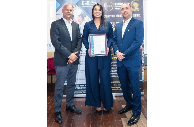 Colin Moore (right) with Amanda Rafeek (centre), and President of the Georgetown Chambers of Commerce and Industry, Timothy Tucker