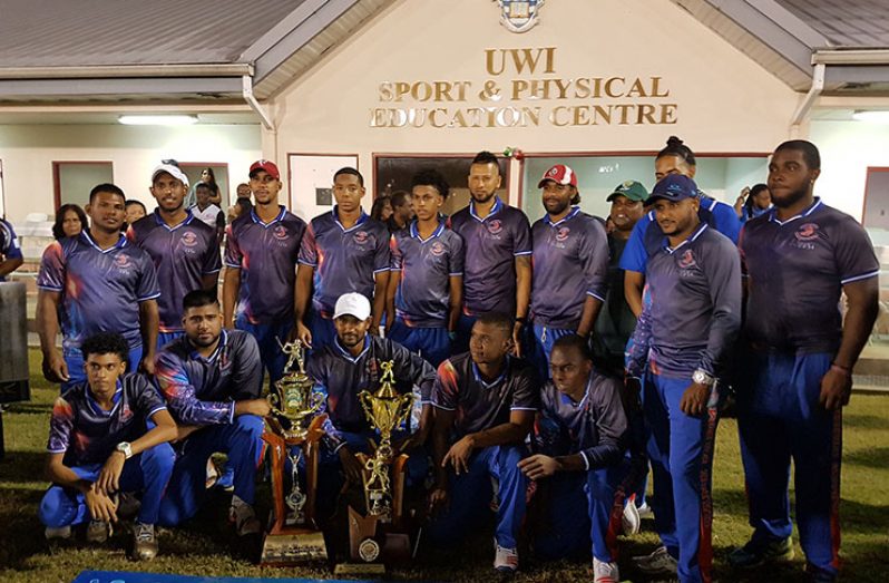 Cane Farm Sports Club pose with UWI UNICOM T20 trophies. Skipper Denesh Ramdin (centre) stoops while Roshon Primus (man-of-the-match) is at extreme right, back row.