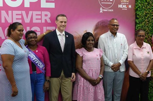 One Communications CEO, Abraham Smith and Minister of Health, Dr Frank Anthony, with survivors and Champions of Hope at the launch of Pinktober 2026 (Sachin Persaud photo)