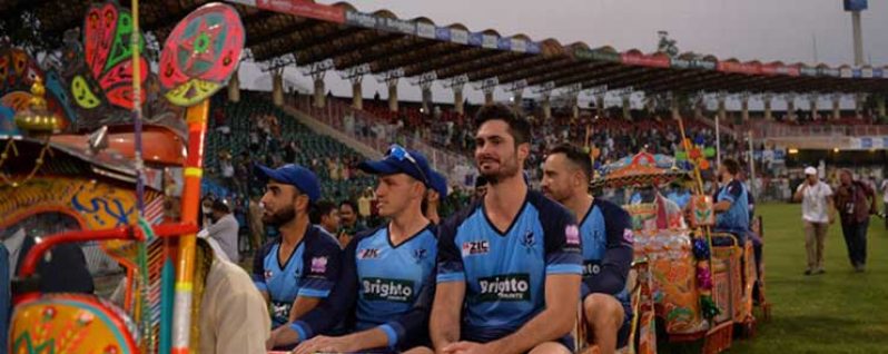 The World XI team players are paraded around the ground in colourful auto-rickshaws. (AFP)