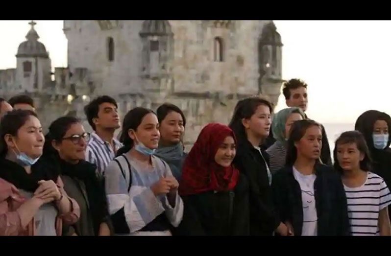 Players of Afghanistan's national women's football team stand near the Belem Tower in Lisbon. (Photograph: Reuters)