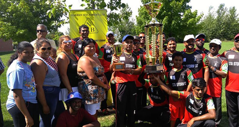 The victorious GTA players pose with their winnings along with members of the Norman Sue Bakery family.
