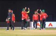 Amazon Warriors players celebrate the fall of another wicket at the Providence Stadium last night