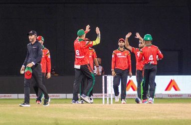 Amazon Warriors players celebrate the fall of another wicket at the Providence Stadium last night