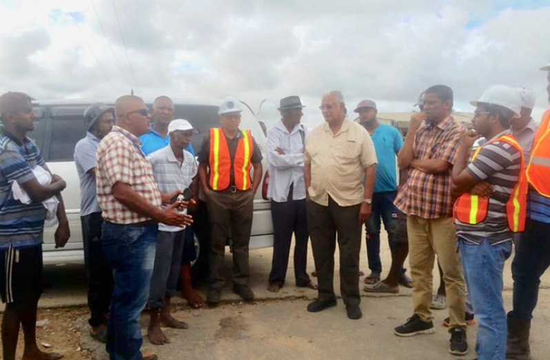 Minister of Agriculture, Noel Holder, and team at Yakasari Black Bush Polder on Friday afternoon