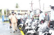 Traffic Chief, Superintendent Ramesh Ashram, inspects the Force’s motorcycles (GPF photo)