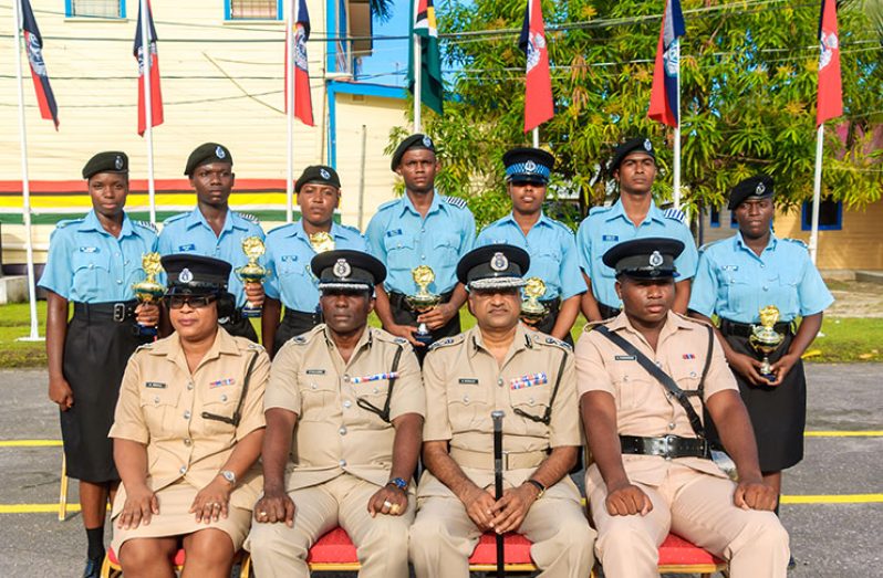 The top performers posing with senior officers of the GPF on Tuesday after the graduation (Delano Williams photo)