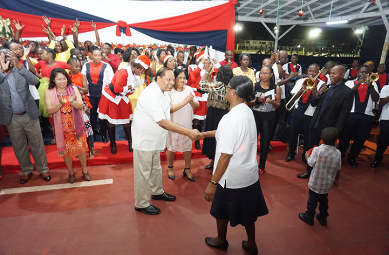 Prime Minister Moses Nagamootoo (left) congratulates Band Mistress Charmaine Stuart on her choreography of the GPF ‘Night of Carols’