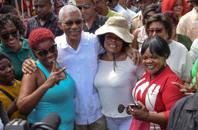 President David Granger with some happy shoppers