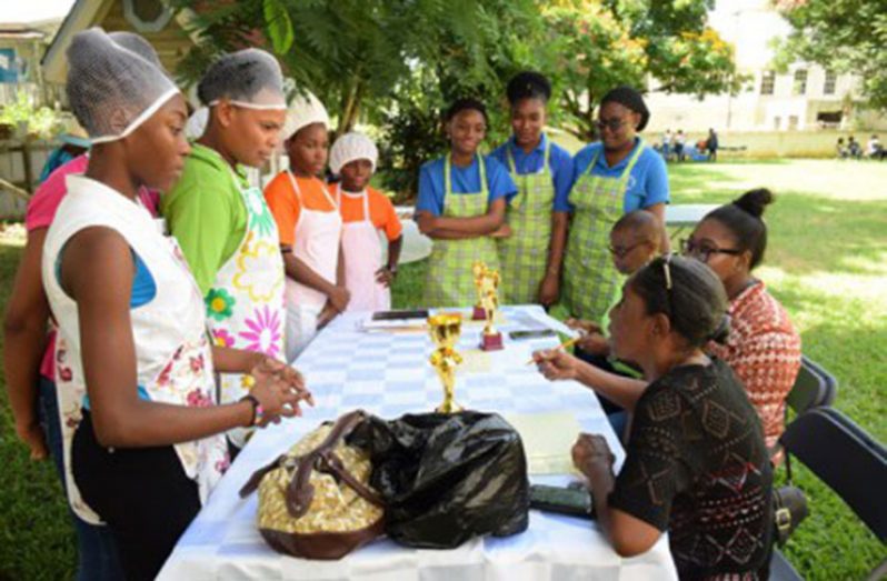 The youths participating in the cook-out listening to the judges before the commencement of the competition