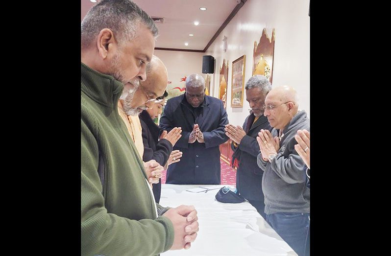 Prime Minister Brigadier (ret’d), Mark Phillips joins in a prayer at the Shri Surya Narayan Mandir in Queens, New York