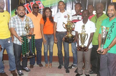 The top four EBFA clubs show off their trophies after receiving cash awards from Ansa McAl’s PRO Darshanie Yusuf (4th left) and Assistant Stag Beer Brand Manager Sean Abel (5th left). Also in photo are EBFA Secretary Franklin Wilson (3rd left) and President Wayne Francois (3rd right)