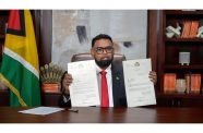 President Ali holds up the signed proclamations