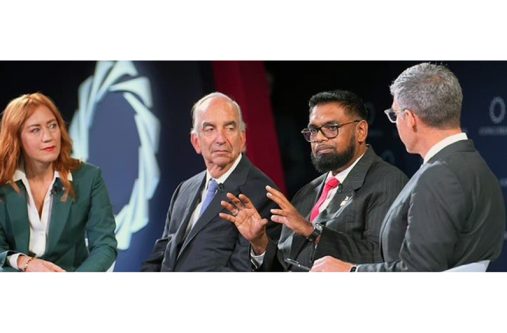 President Dr. Irfaan Ali (second from right) sits with Hess Corporation CEO, John Hess (second from left) and Dr Rachel Vreeman (first from left) from the Icahn School of Medicine at Mount Sinai (Hess photo)