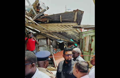 President Dr. Irfaan Ali at the scene of the Stabroek Market collapse (Cindy Parkinson photo; others by Delano Williams)