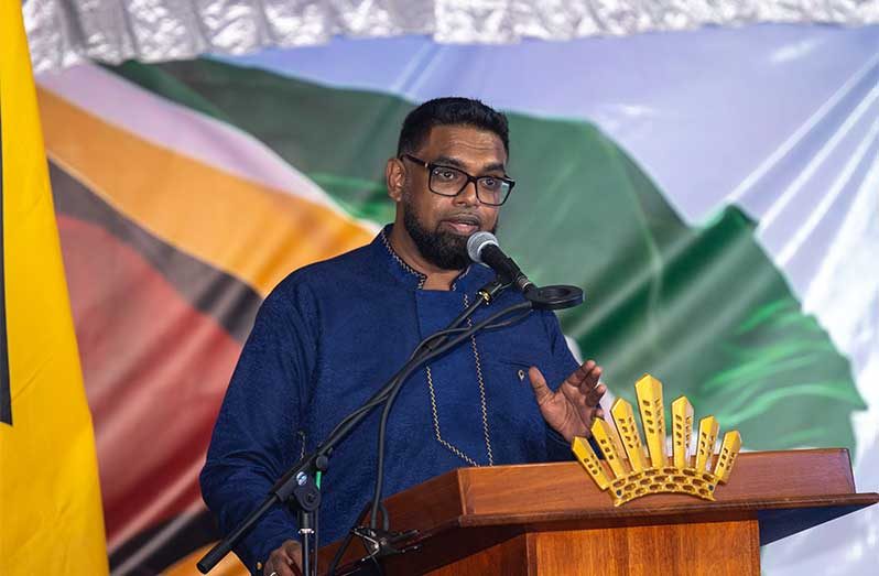 President Dr. Irfaan Ali addresses those gathered at a commissioning ceremony held on Monday for the new Ogle to Eccles Four Lane Highway. The thoroughfare is expected to cut down travel time between the East Coast and East Bank of Demerara significantly (Delano Williams photos)