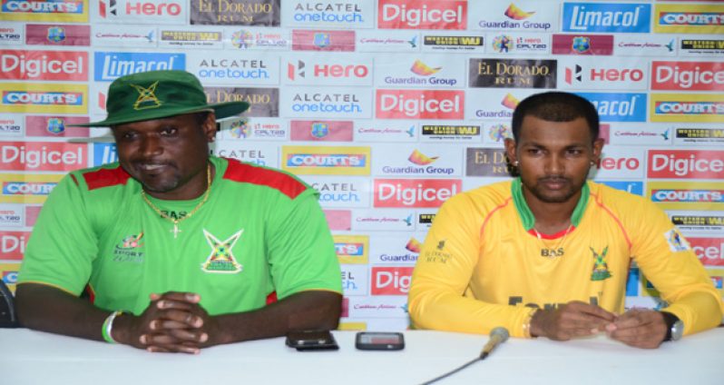 Amazon Warriors Coach Carl Hooper (left) makes a point during the post match press conference. Captain Denesh Ramdin (right) looks on (Adrian Narine Photo)