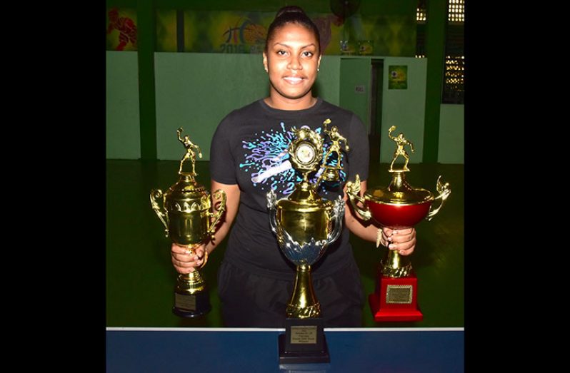 Priscilla displaying just a few of her many trophies