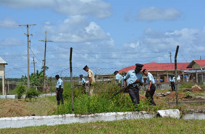 A file photo of Police searching a section of the Timehri Prison compound