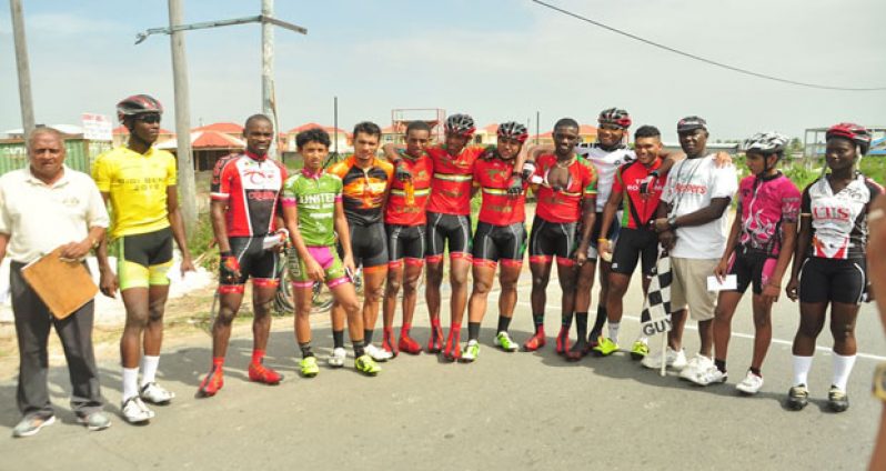 Prize winners of the various categories of the annual NSC 40-mile cycle road race strike a pose with race organiser Hassan Mohamed yesterday.