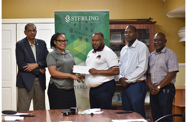 Sterling Products PRO Youlandra McCammon presents a cheque to Petra Director Troy Mendonca in the presence of Sterling CEO  Ramsey Ali, Marketing Manager Dellon Lynch, and Petra’s  ‘rep’ Troy Peters