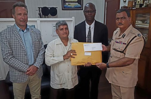 From left-right-UK Advisor to SOCU, Dr. Sam Sittlington, Minister Sharma, ASP, Sydney James and Commissioner of Police (ag), David Ramnarine