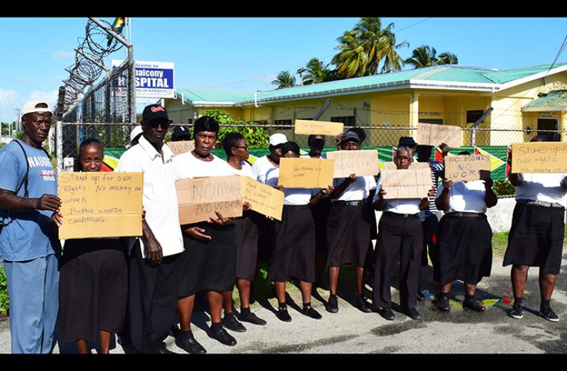 Some of the affected guards in a picketing protest at Mahaicony