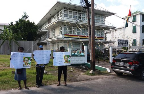 Relatives of Courtney Crum-Ewing protesting outside of the Attorney General’s chambers