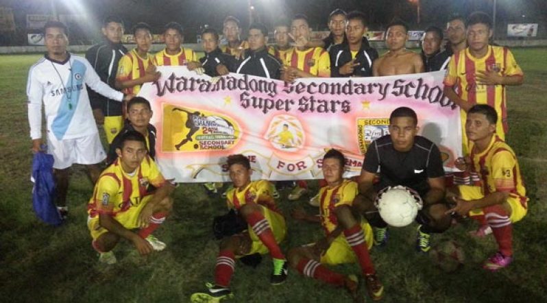 The victorious Waramadong Secondary School team strike a pose in front of their banner, following their 2-0 win over North Georgetown last Saturday at the Georgetown Football Club ground.