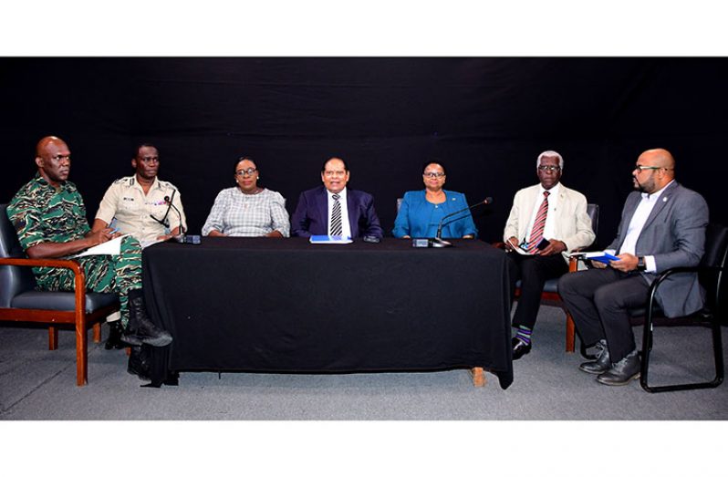 Prime Minister Moses Nagamootoo (centre) with others at the head table at Tuesday’s Ministerial Task Force press conference; from left are: Director-General of the Civil Defence Commission, Kester Craig; Commissioner of Police, Leslie James; Minister of Education, Dr Nicolette Henry; Minister of Public Health, Volda Lawrence; Director-General,Guyana Civil Aviation Authority (GCAA), Egbert Field; and Director of of Public Information, Imran Khan (Adrian Narine photo)