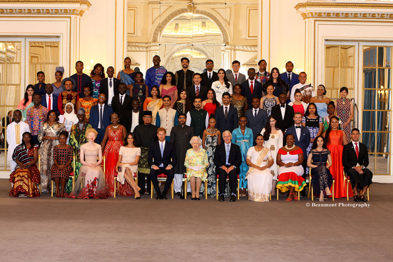 Queen Elizabeth and other members of the royal family pose with young leaders at a special ceremony at Buckingham Palace, London, in honour of the work they are doing to transform lives in their communities