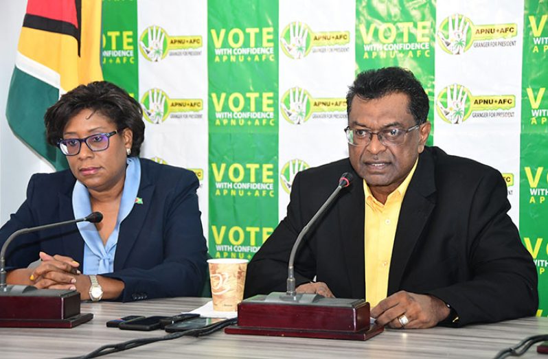 Minister of Public Security, Khemraj Ramttan, and Minister of Public Telecommunications, Catherine Hughes, addressing media operatives at the APNU+AFC Command Centre
