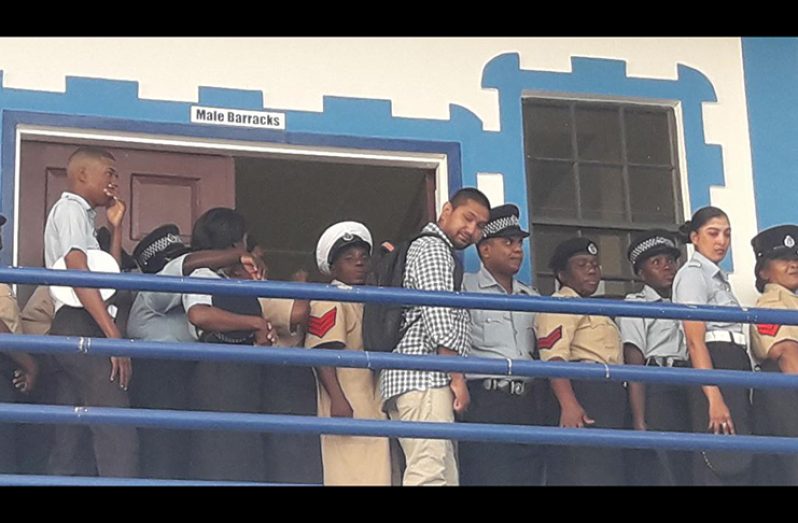 Ranks of the Guyana Police Force waiting to vote at the Central Police Station