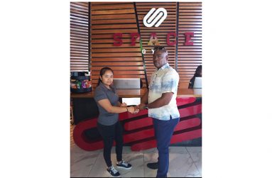 Space Gym Supervisor, Roann Pierre, hands over sponsorship to GAPLF head, Frankie Wilson yesterday