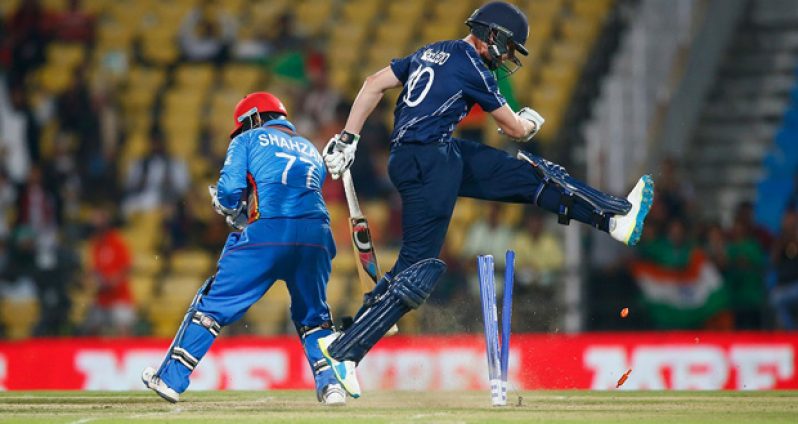Calum MacLeod reacts after being run out by Mohammad Shahzad,in a  World T20 qualifier, Group B,  match in Nagpur, yesterday.