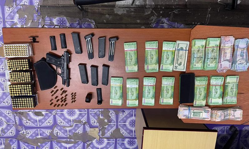 The stolen cash, firearm and other items which were recovered by the police (Guyana Police Force photo)