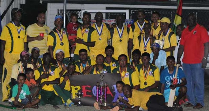 The victorious Regal Open (front) and Masters team strike a pose with their spoils, following their respective victories last Sunday in the GSCL Inc./NSC inaugural Independence Cup tournament.