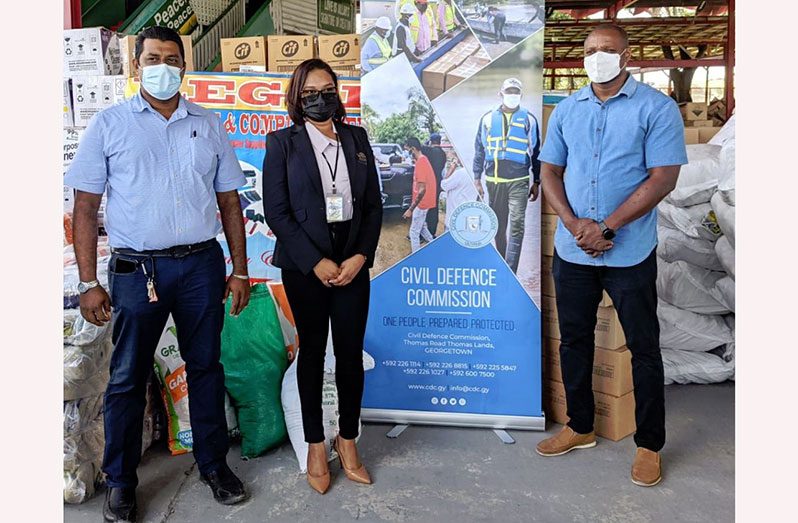 Telesha Ousman (centre) along with Imran Ally (left) and Deputy Director-General of the CDC, Major Loring Benons at the handing over at the Muslim Youth Organisation on Woolford Avenue, Georgetown (DPI photo)