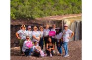 Survivors stand united at the Kaieteur Falls, symbolising strength, support, and the power of community through Recover Guyana and Guyana Tourism Authority's adventure tour