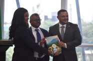 Chief Executive Officer of Cybele Energy along with a representative of her company poses with Minister of Natural Resources, Vickram Bharrat after the signing