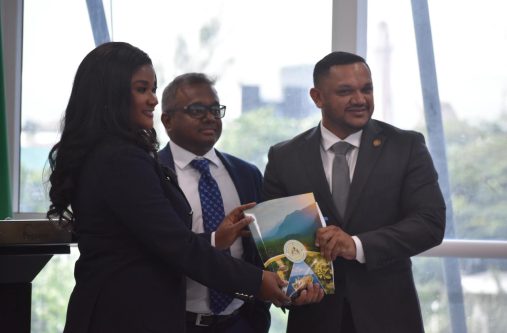 Chief Executive Officer of Cybele Energy along with a representative of her company poses with Minister of Natural Resources, Vickram Bharrat after the signing
