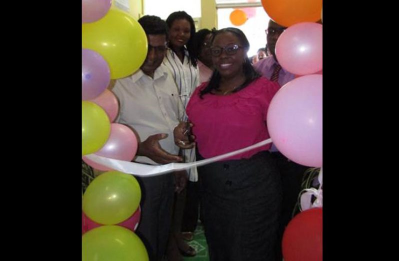 LHC CEO, Dr Mohammed Riyasat assists Mayor of Linden, Waneka Arrindell, to cut the ceremonial ribbon to open the ‘One Stop Centre’