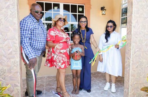 From left to right: The Prime Minister’s Representative Arnold Adams, Toshao of Mainstay/Whyaka Masha Williams, Tourism Minister Oneidge Walrond and Regional Executive Officer Susanah Saywack join a young resident at the ribbon-cutting exercise to officially commission the Lake View Cabins