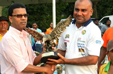 FLASHBACK:  Guyana Floodlight Softball Cricket Association (GFSCA) captain Ricky Deonarine collects the Eagle for winning the 2015 Legends Championship from sponsor Johnny, of Johnny’s Restaurant & Bar.