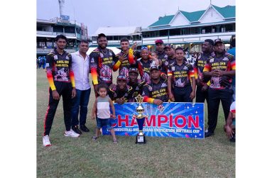 The victorious Ariel Knight Riders players pose with their winnings.