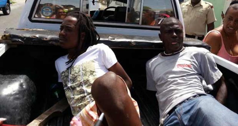White t-shirt – accused Anikie Rogers, 
Gray t-shirt – accused Peter McKenzie, 
Woman in white vest - Alana Taylor