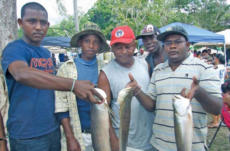 This group display their catch after the fish-catching competition