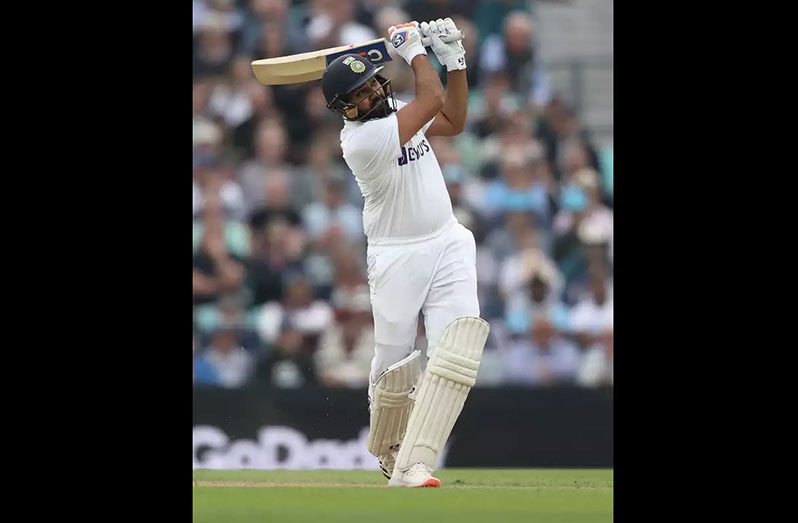 Rohit Sharma competed his 8th Test century with a lofted six off spinner Moeen Ali. (getty Images)